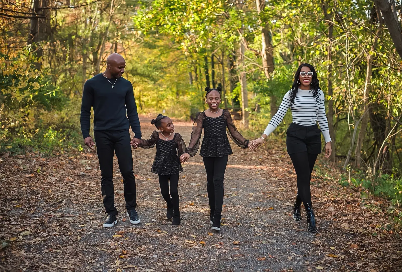 Dr. Ego-Osuala with his wife and daughters